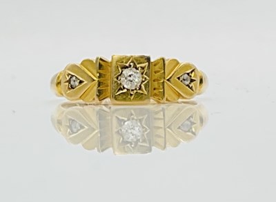 Lot 701 - An 18ct yellow gold and three stone diamond...