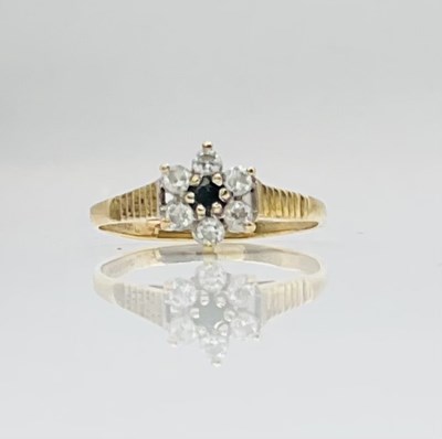 Lot 769 - A 9ct yellow gold floral set dress ring,...