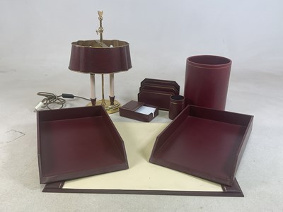 Lot 44 - HARRODS; a burgundy leather desk suite set,...