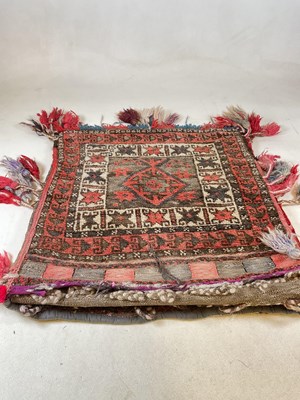 Lot 453 - A Turkish saddle bag, full length 135 x 60cm.