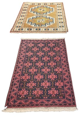 Lot 137 - A modern hand woven red and blue ground...