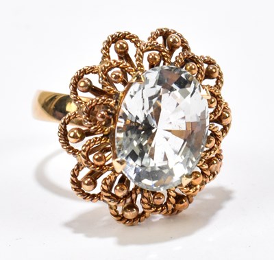 Lot 1077A - A yellow metal dress ring, set with a central...