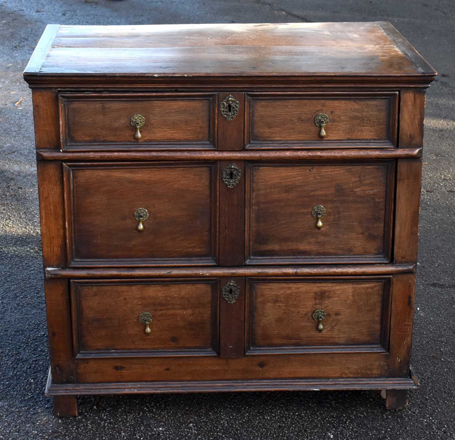 Lot 1511 - An 18th century and later oak chest of three...