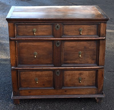 Lot 1511 - An 18th century and later oak chest of three...