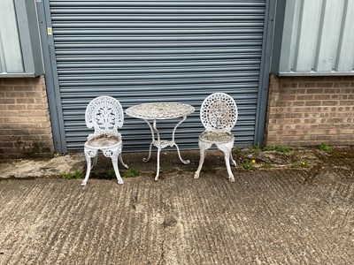 Lot 153 - A white painted, wrought iron table and two...