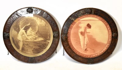 Lot 384 - A pair of Arts & Craft style copper framed circular prints