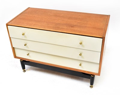 Lot 74 - G-PLAN; a pair of white fronted three-drawer...