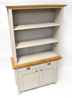 Lot 31 - A modern dresser with three-shelf top on a...