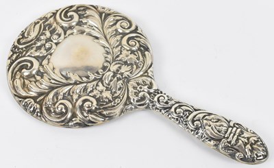 Lot 836 - An ornate hallmarked silver backed hand mirror...