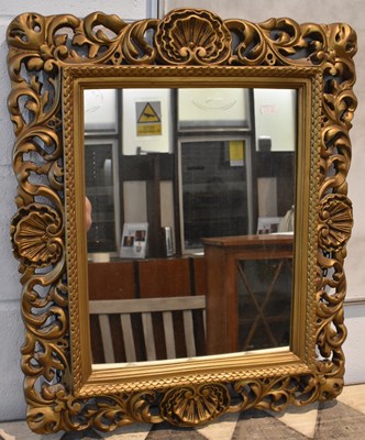 Lot 81 - An ornate gilt framed wall mirror, 67 x 57cm.