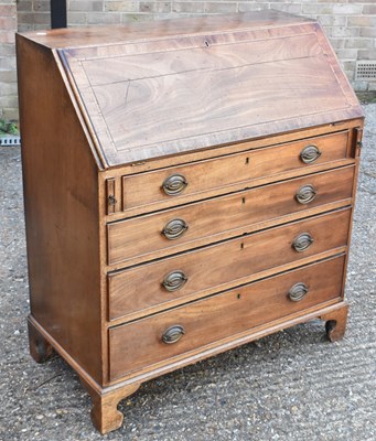 Lot 89 - A 19th century mahogany bureau, the fall front...