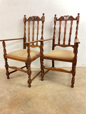 Lot 779 - A pair of early 20th century oak open arm...