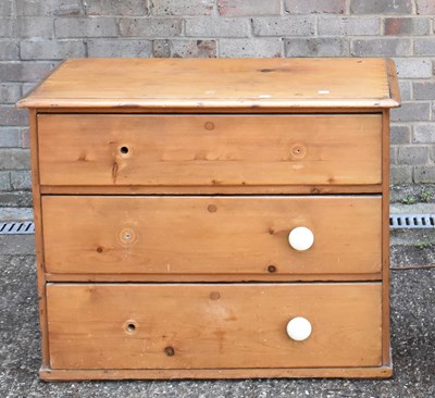 Lot 114 - An old pine chest of three long drawers, width...