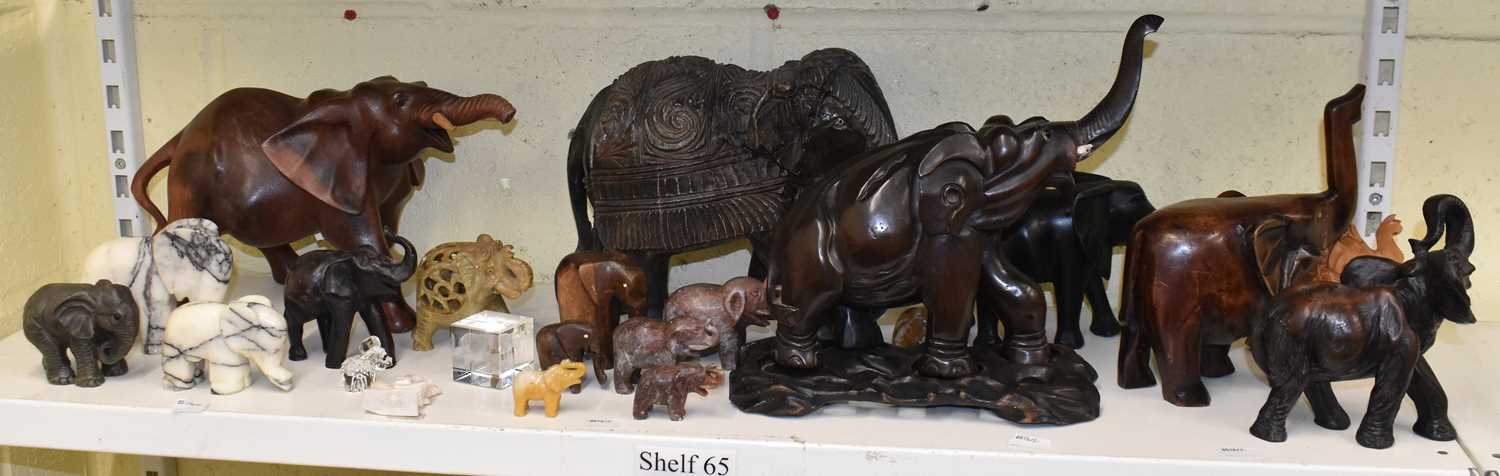 Lot 243 - A collection of ten wooden models of elephants...