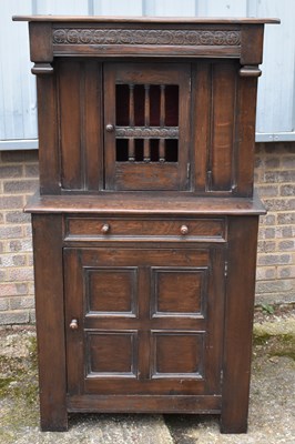 Lot 109 - A reproduction oak court cupboard with pierced...