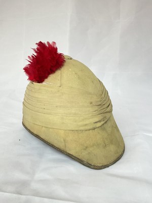 Lot 153 - A military pith helmet with red feather plume,...