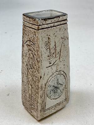 Lot 215 - TROIKA; a cream glazed coffin vase decorated...