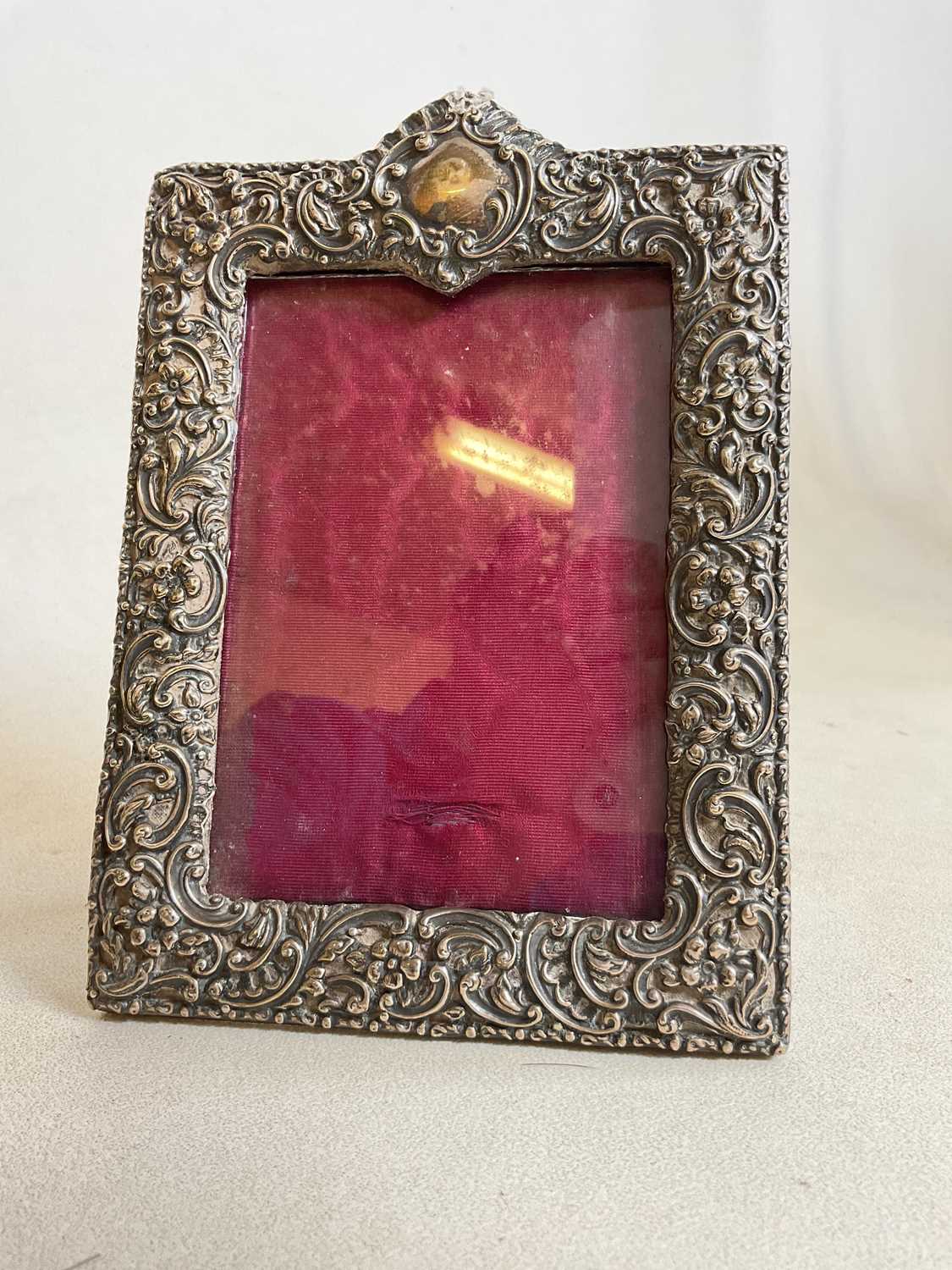 Lot 427 - A small hallmarked silver photo frame with...