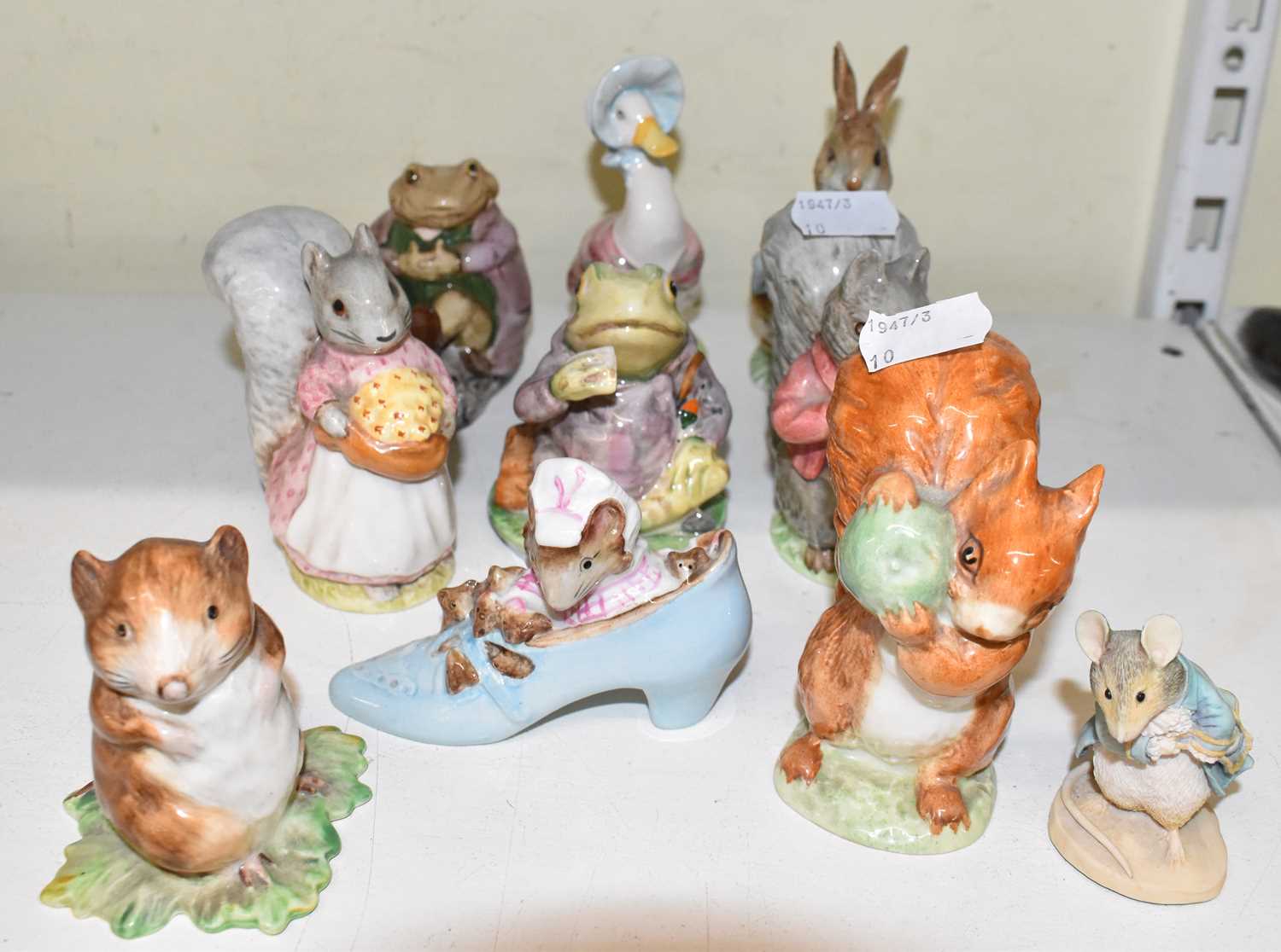 Lot 501 - BESWICK: Nine Beatrix Potter figures including...