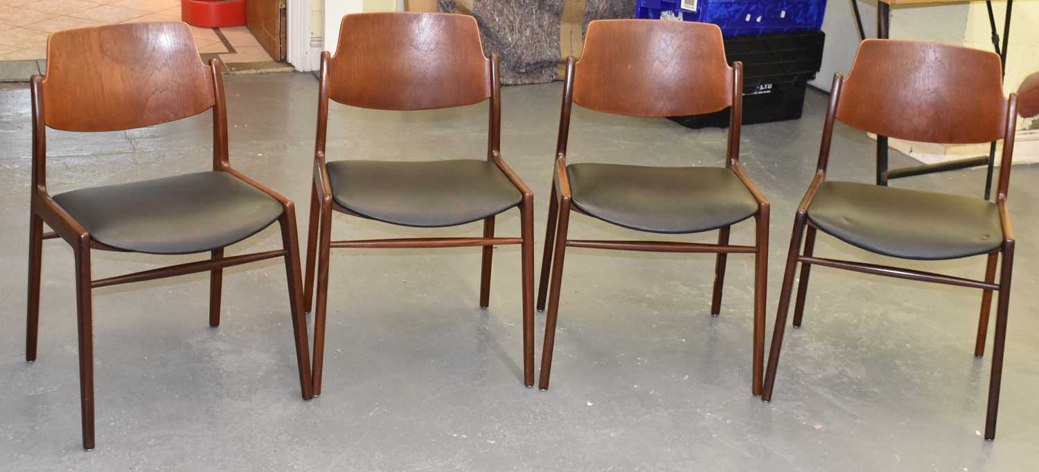 Lot 94 A set of four teak dining chairs.