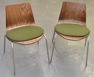 Lot 143 - A pair of modern plywood office chairs on...