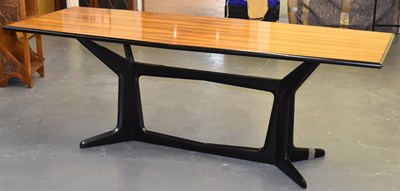 Lot 52 - A large retro dining table on ebonised base,...