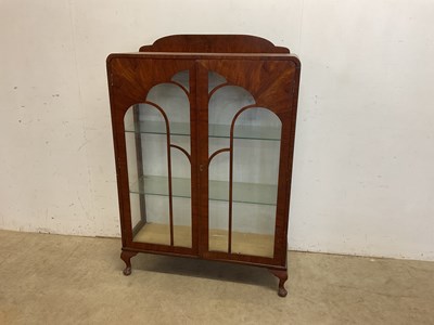 Lot 644 - An early 20th century stepped cloud walnut...