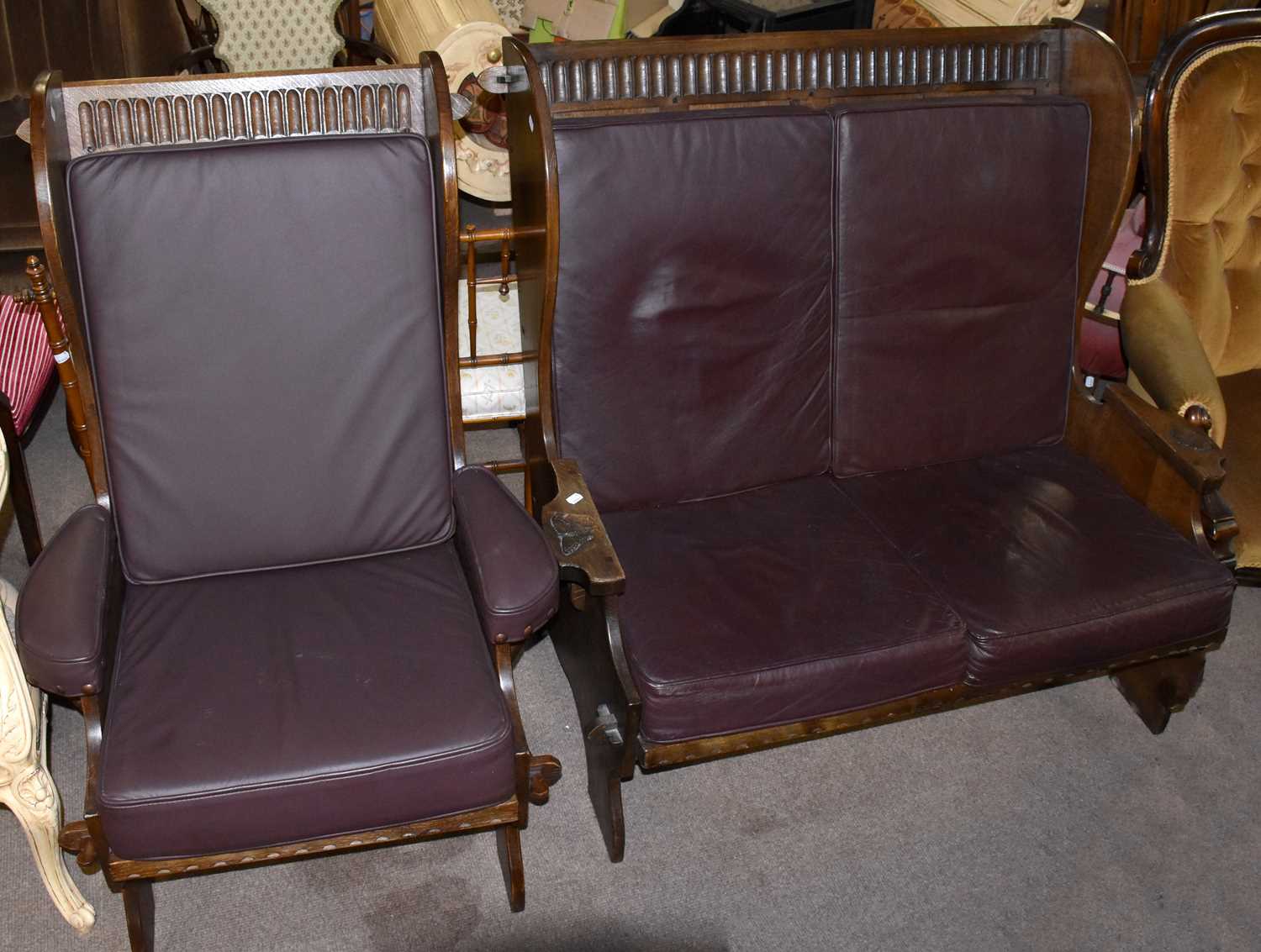 Lot 1566 - NIGEL GRIFFITHS; a carved oak settle and