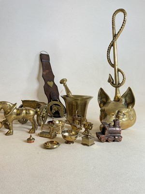 Lot 207 - A collection of brassware to include a fox...