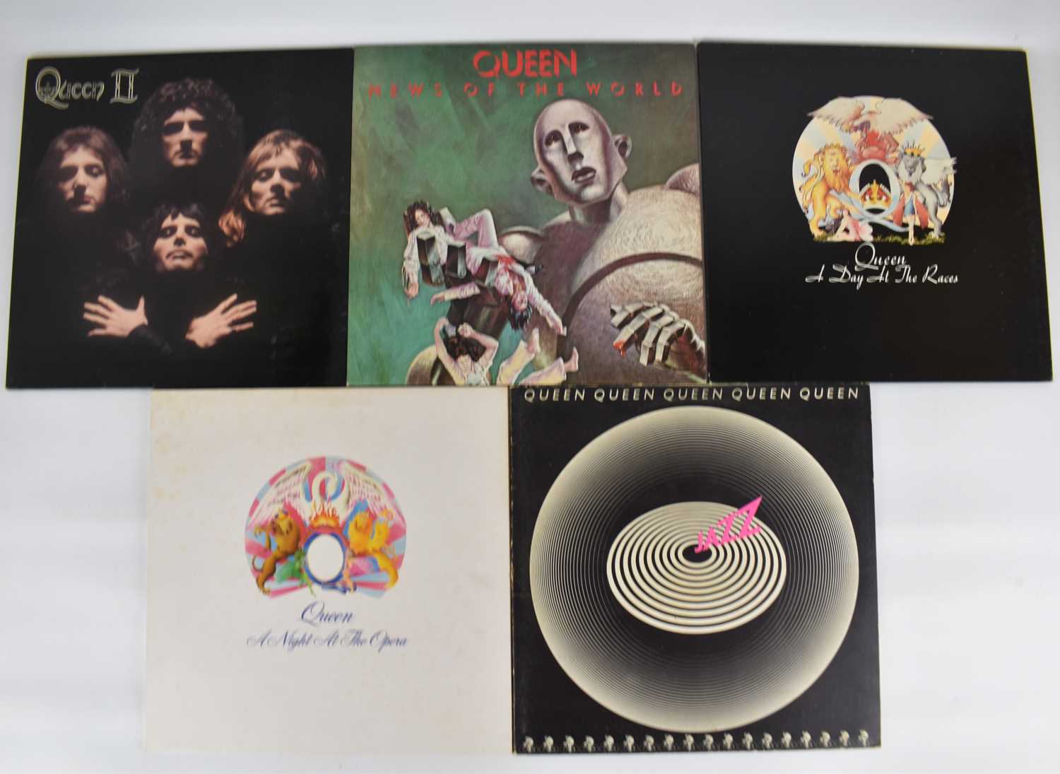 Lot 242 - QUEEN; five albums comprising 'A Day at the