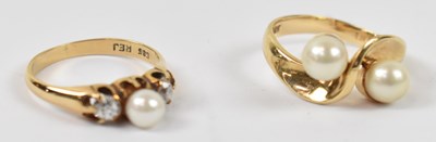 Lot 853 - A 14ct yellow gold crossover ring set with two...
