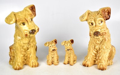 Lot 433 - SYLVAC; two large pairs of seated dogs in a brown colourway