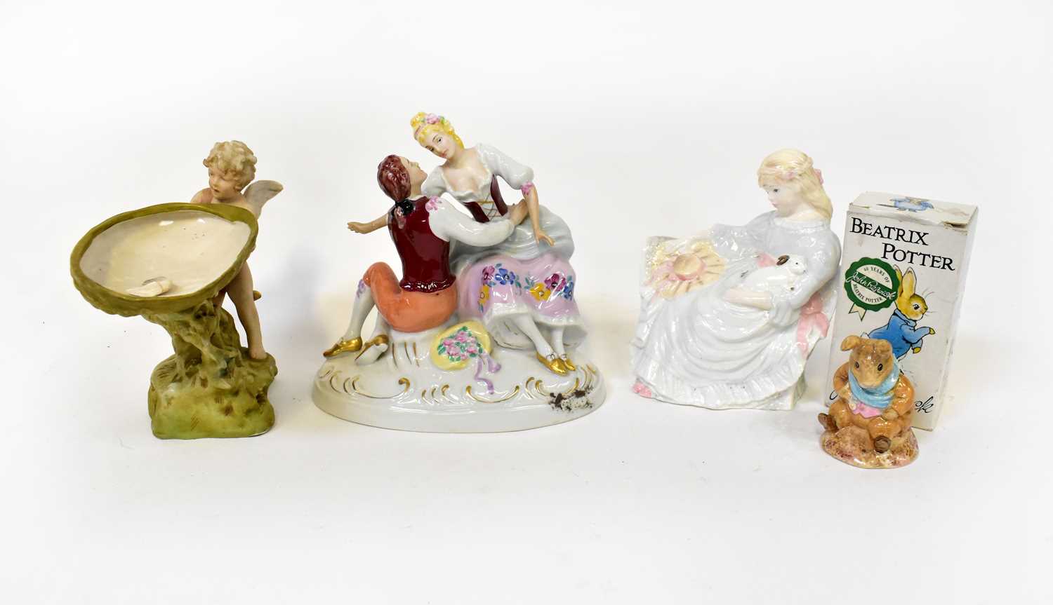 Lot 667 - Two Royal Dux figures, comprising a seated...