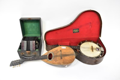 Lot 218 - CRANE & SONS; a cased banjo, an early 20th...