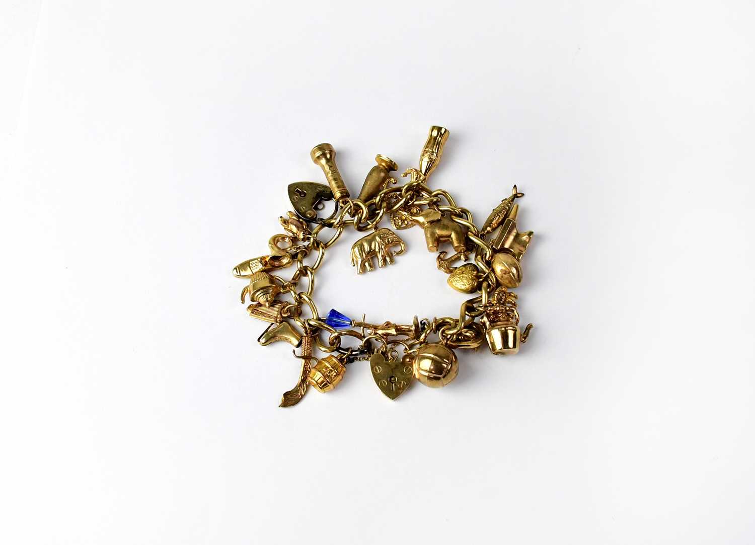 Lot 979 A 9ct yellow gold link charm bracelet with