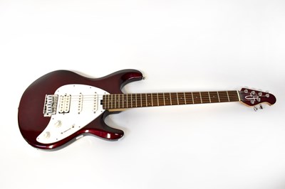 Lot 217 - A red electric guitar with white motif to neck.