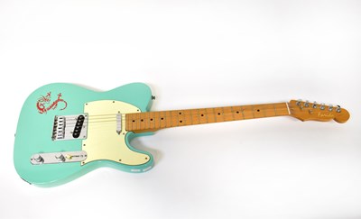 Lot 198 - FARIDA; an electric guitar with turquoise body...