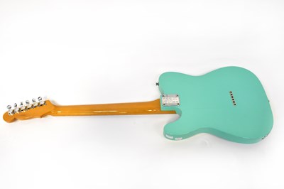 Lot 198 - FARIDA; an electric guitar with turquoise body...