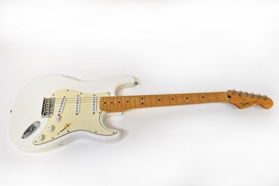 Lot 206 - FENDER; a Stratocaster white body electric...