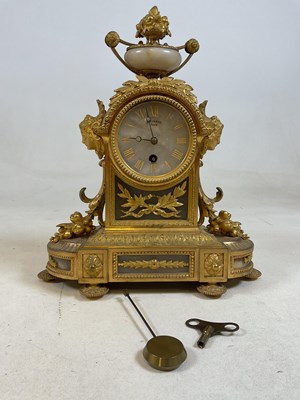 Lot 398 - A late 19th century French ormolu mantel clock...