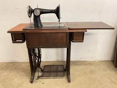 Lot 777 - A Singer treadle sewing machine set into a...