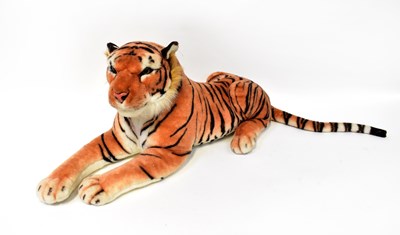 Lot 121 - A large stuffed cuddly toy tiger, length 80cm.