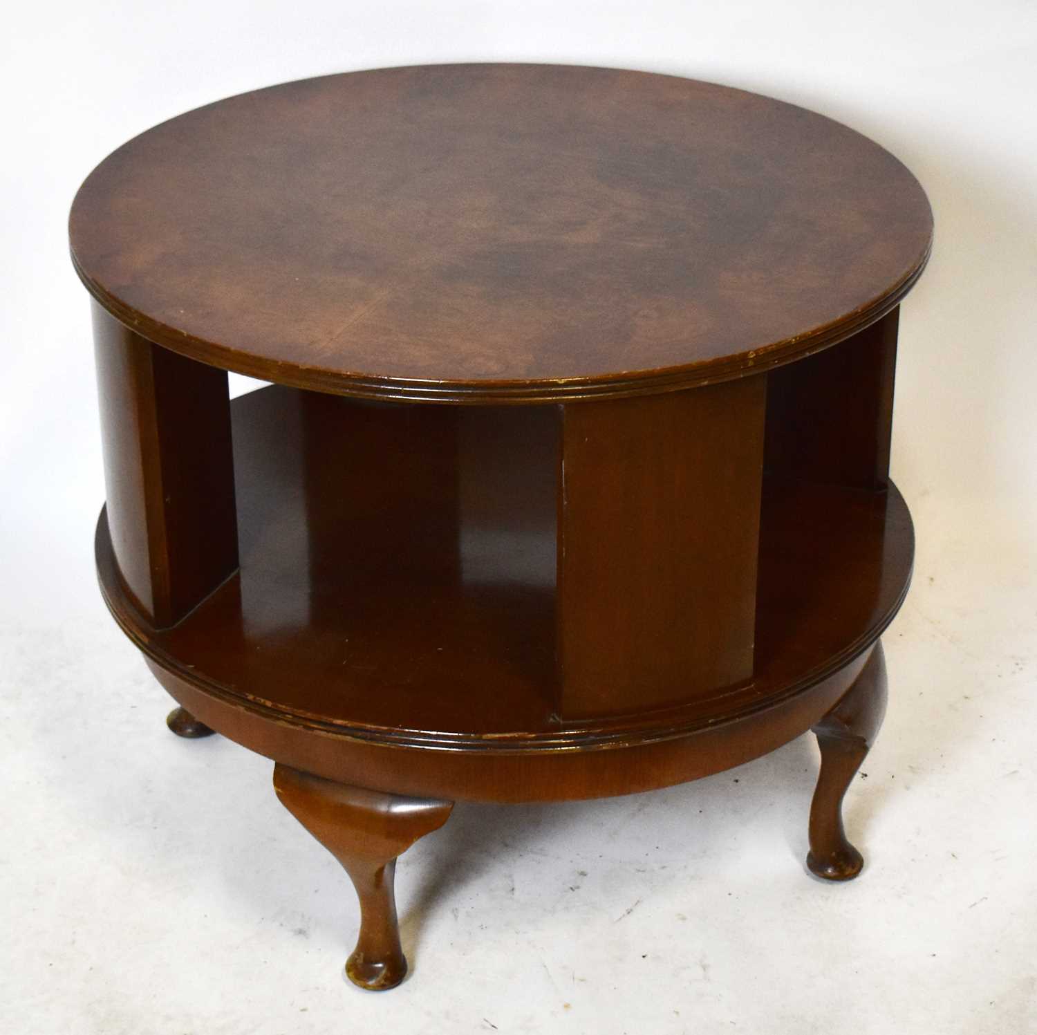 Lot 1755 - A walnut circular revolving coffee table