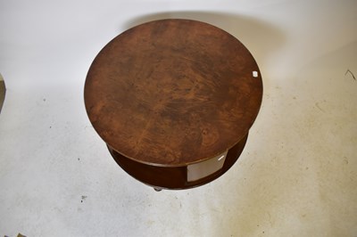 Lot 1755 - A walnut circular revolving coffee table