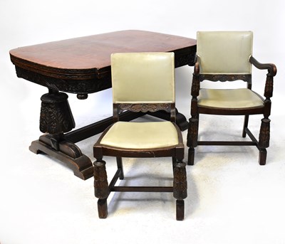 Lot 60 - A good quality 1920s/30s carved oak dining...