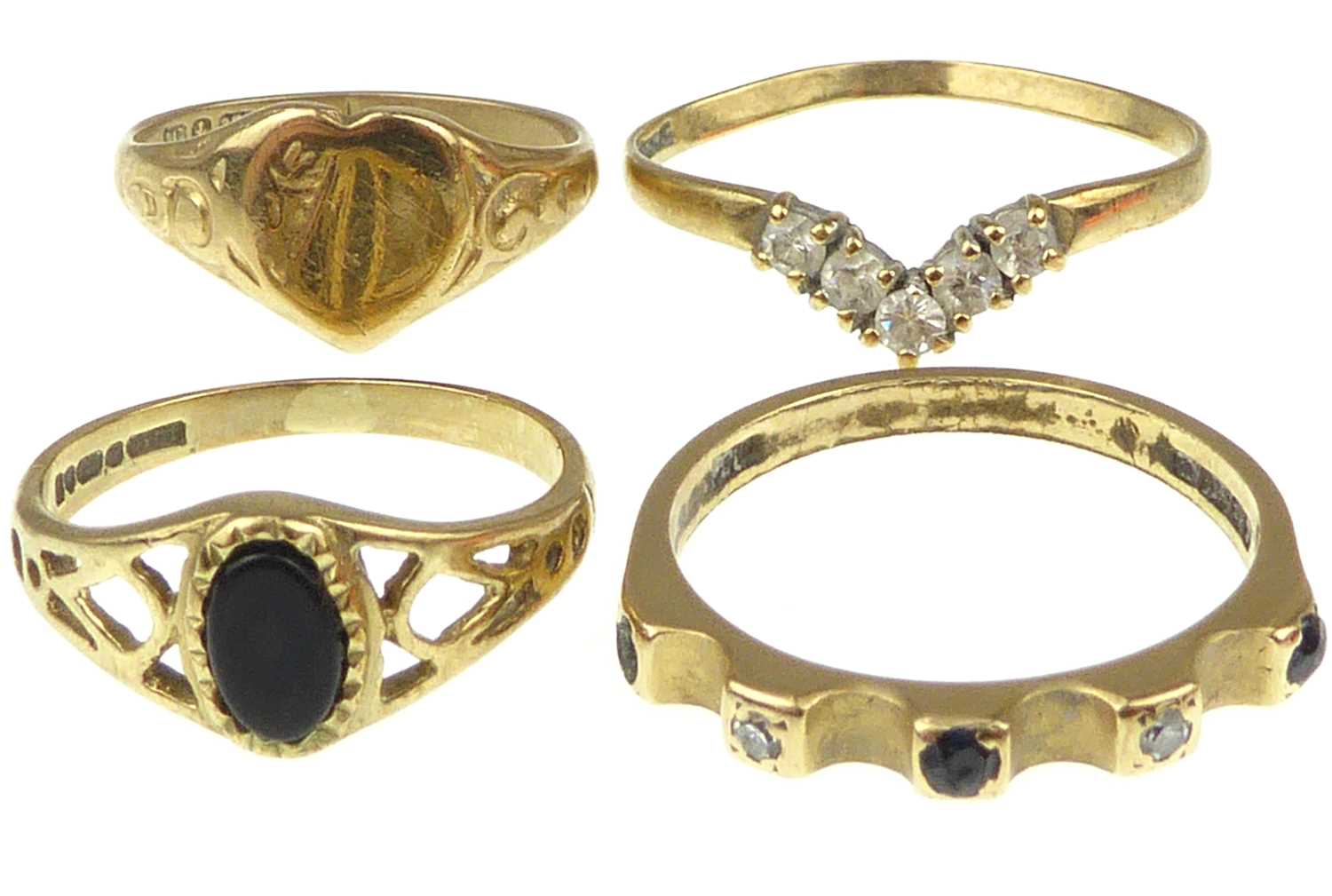 Lot 970 - Four 9ct gold rings comprising a modern
