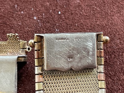 Lot 538 - A 9ct three tone gold broad flat link bracelet,...