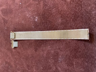 Lot 538 - A 9ct three tone gold broad flat link bracelet,...