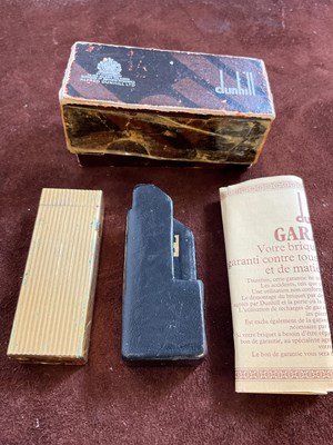 Lot 26 - DUNHILL; a vintage gold plated lighter in...