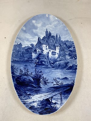 Lot 222 - A large Dutch oval blue and white landscape...